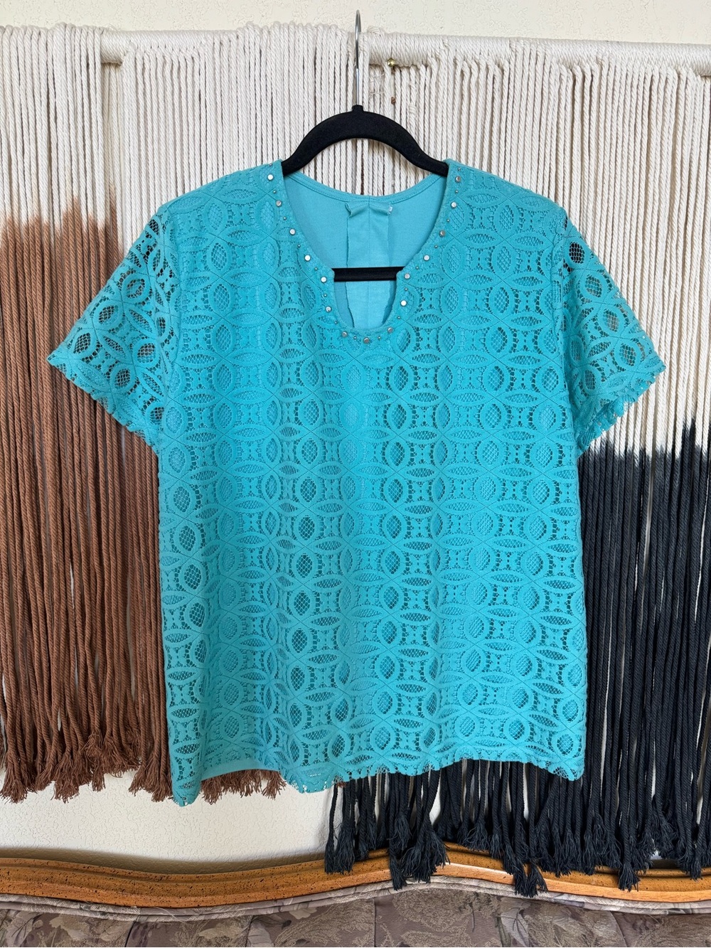Blue lace top with beaded details on the neckline; good condition